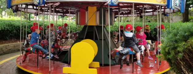 group of kids riding a rides